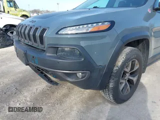 2014 Jeep Cherokee Trailhawk z VIN 1C4PJMBS5EW147579, wystawiony jako IAAI lot #41781543 z przebiegiem 155 751 mil mil oraz . Historia ofert i sprzedaży dostępna na DreamBid. Obrazek 20.