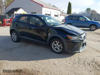 2016 Mazda CX-3 Sport with VIN JM1DKBB75G0124907, listed as a IAAI auction lot 42107232 with 128,411 mi miles. Bid and sale history available at carsss.com. Image 1.