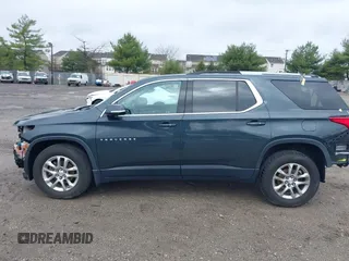 2018 Chevrolet Traverse LT Cloth z VIN 1GNEVGKW7JJ156198, wystawiony jako IAAI lot #41909259 z przebiegiem 82 719 mil mil oraz . Historia ofert i sprzedaży dostępna na DreamBid. Obrazek 15.