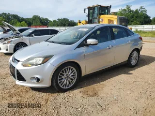 2014 Ford Focus Titanium with VIN 1FADP3J22EL147981, listed as a Copart auction lot 61061415 with 145,196 mi miles and Salvage title. Bid and sale history available at DreamBid. Image 1.