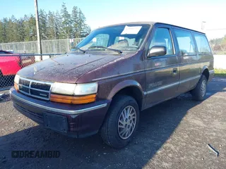 1993 Dodge Grand Caravan with VIN 1B4GK44R4PX675504, listed as a IAAI auction lot 42010737 with 219,886 mi miles and . Bid and sale history available at DreamBid. Image 2.
