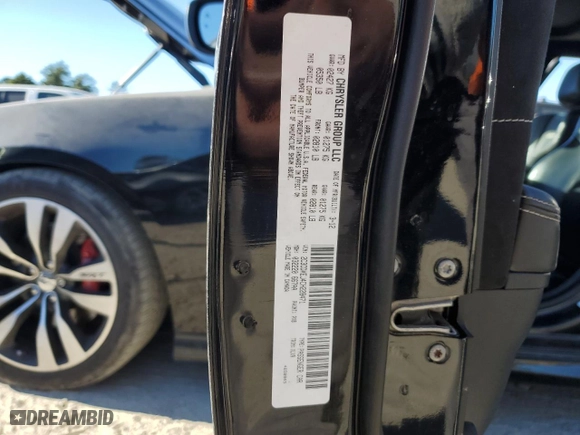 2012 Dodge Charger SRT8 with VIN 2C3CDXEJ4CH228471, listed as a Copart auction lot 82397844 with 125,437 mi miles and Salvage Title. Bid and sale history available at carsss.com. Image 14.