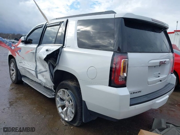 2016 GMC Yukon SLT with VIN 1GKS2BKCXGR195010, listed as a IAAI auction lot 41226537 with 130,919 mi miles. Bid and sale history available at carsss.com. Image 3.