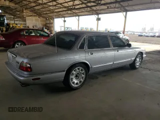 2000 Jaguar XJ with VIN SAJDA25B8YMF04079, listed as a Copart auction lot 50592595 with 131,647 mi miles and Salvage title. Bid and sale history available at DreamBid. Image 3.