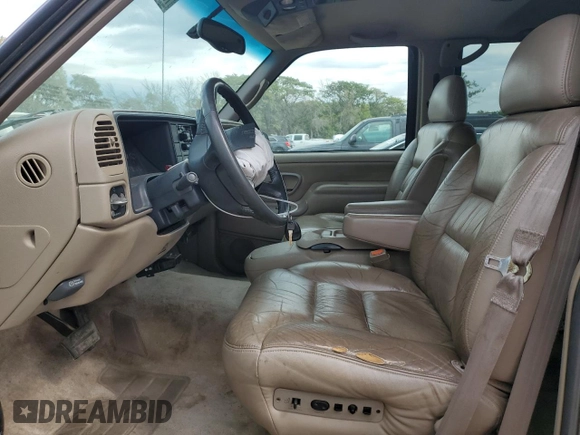 1999 GMC Yukon with VIN 1GKEK13R9XJ787877, listed as a Copart auction lot 72185044 with 191,710 mi miles and Salvage Title. Bid and sale history available at carsss.com. Image 7.