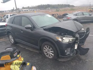 2016 Mazda CX-5 Touring with VIN JM3KE2CY7G0630056, listed as a IAAI auction lot 41817525 with 97,844 mi miles and . Bid and sale history available at carsss.com. Image 1.