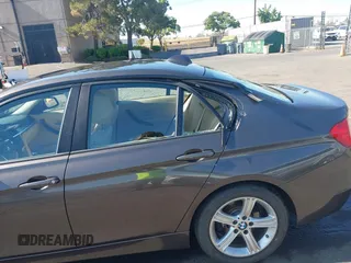 2014 BMW 3 Series 328i with VIN WBA3C1C57EK116483, listed as a IAAI auction lot 42697759 with 113,010 mi miles and . Bid and sale history available at DreamBid. Image 6.