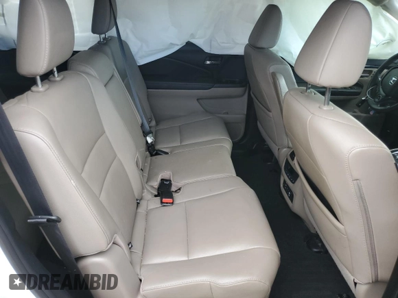 2017 Honda Pilot Touring z VIN 5FNYF6H92HB067140, wystawiony jako Copart lot #72200584 z przebiegiem 127 856 mil mil oraz Szkoda całkowita • Salvage title. Historia ofert i sprzedaży dostępna na DreamBid. Obrazek 12.