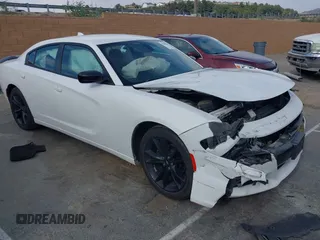 2018 Dodge Charger SXT Plus with VIN 2C3CDXHG4JH187580, listed as a IAAI auction lot 42024602 with 203,843 mi miles and . Bid and sale history available at carsss.com. Image 1.
