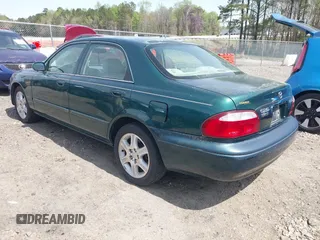 2001 Mazda 626 LX with VIN 1YVGF22D915241384, listed as a IAAI auction lot 41927705 with 231,801 mi miles. Bid and sale history available at carsss.com. Image 3.