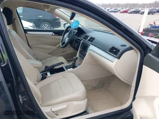 2012 Volkswagen Passat SE with VIN 1VWBP7A37CC021336, listed as a IAAI auction lot 41724459 with 124,832 mi miles. Bid and sale history available at carsss.com. Image 5.