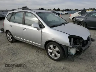 2009 Kia Rondo LX Base with VIN KNAFG528097222268, listed as a Copart auction lot 77797124 with 184,569 mi miles and Salvage Title. Bid and sale history available at carsss.com. Image 4.