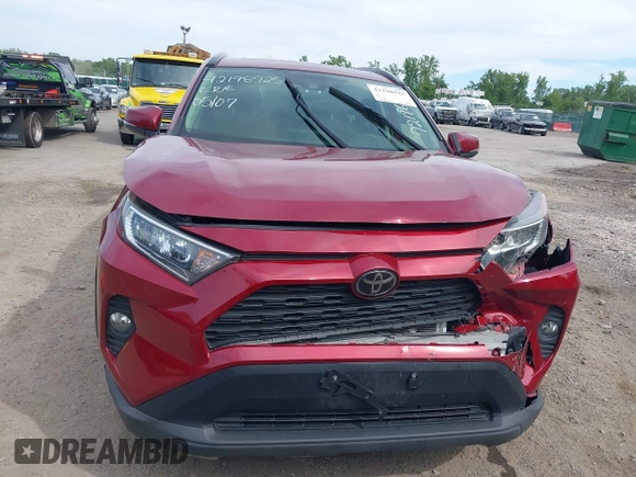 2019 Toyota RAV4 XLE with VIN JTMP1RFV2KD021348, listed as a IAAI auction lot 42198925 with 130,838 mi miles and . Bid and sale history available at DreamBid. Image 6.
