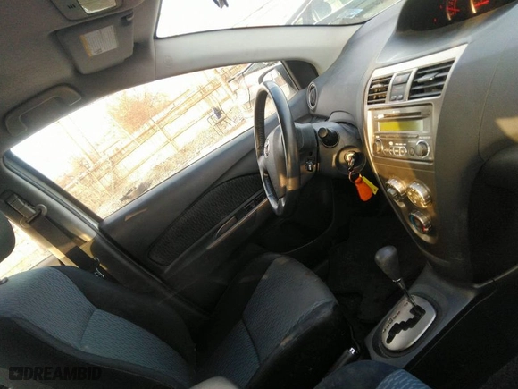 2010 Toyota Yaris with VIN JTDBT4K3XA1360452, listed as a IAAI auction lot 41557092 with 107,989 mi miles. Bid and sale history available at carsss.com. Image 5.
