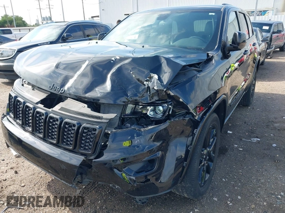 2021 Jeep Grand Cherokee Laredo E with VIN 1C4RJEAG0MC571375, listed as a IAAI auction lot 42087648 with 29,358 mi miles and . Bid and sale history available at DreamBid. Image 6.