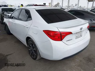 2019 Toyota Corolla L with VIN 5YFBURHE7KP862111, listed as a IAAI auction lot 42205368 with 96,823 mi miles and . Bid and sale history available at DreamBid. Image 3.