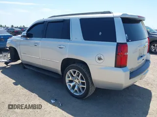 2015 Chevrolet Tahoe LT with VIN 1GNSCBKC6FR303850, listed as a IAAI auction lot 42254115 with 147,856 mi miles and . Bid and sale history available at DreamBid. Image 3.
