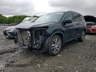 2017 Honda Pilot Touring with VIN 5FNYF6H90HB001959, listed as a Copart auction lot 57564705 with 68,028 mi miles and Salvage title. Bid and sale history available at DreamBid. Image 1.