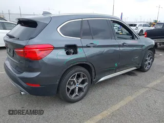 2016 BMW X1 xDrive28i with VIN WBXHT3C32GP886084, listed as a IAAI auction lot 41895754 with 85,662 mi miles and . Bid and sale history available at DreamBid. Image 4.
