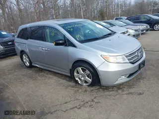 2013 Honda Odyssey Touring with VIN 5FNRL5H97DB021403, listed as a IAAI auction lot 41606606 with 223,547 mi miles. Bid and sale history available at carsss.com. Image 1.