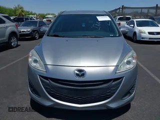 2015 Mazda 5 Sport z VIN JM1CW2BL3F0185779, wystawiony jako IAAI lot #42609991 z przebiegiem 158 403 mil mil oraz . Historia ofert i sprzedaży dostępna na DreamBid. Obrazek 6.