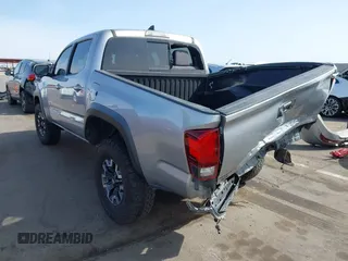 2018 Toyota Tacoma SR5 with VIN 3TMAZ5CN0JM053861, listed as a IAAI auction lot 41920377 with 104,015 mi miles and . Bid and sale history available at DreamBid. Image 3.