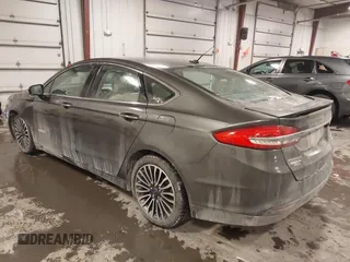 2018 Ford Fusion Hybrid Titanium with VIN 3FA6P0RU4JR147831, listed as a IAAI auction lot 41586033 with 101,088 mi miles. Bid and sale history available at carsss.com. Image 3.