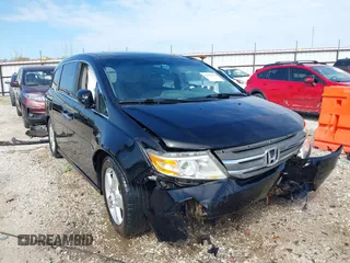 2013 Honda Odyssey Touring with VIN 5FNRL5H92DB018876, listed as a IAAI auction lot 42026385 with 171,607 mi miles and . Bid and sale history available at DreamBid. Image 1.