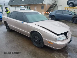 1999 Oldsmobile 88 LS z VIN 1G3HN52KXX4803465, wystawiony jako IAAI lot #42166327 z przebiegiem 130 312 mil mil oraz . Historia ofert i sprzedaży dostępna na DreamBid. Obrazek 1.