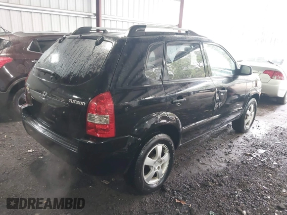 2005 Hyundai Tucson GL with VIN KM8JM12B75U072080, listed as a IAAI auction lot 41779464 with 191,771 mi miles. Bid and sale history available at carsss.com. Image 4.
