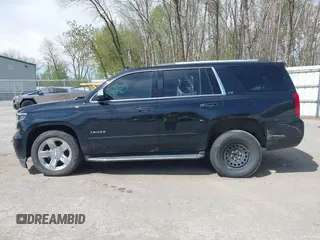 2015 Chevrolet Tahoe LTZ with VIN 1GNSKCKC8FR514671, listed as a IAAI auction lot 42157084 with 182,665 mi miles and . Bid and sale history available at DreamBid. Image 14.
