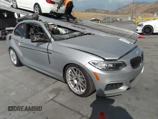 2015 BMW 2 Series M235i with VIN WBA1J7C58FV358795, listed as a IAAI auction lot 33819484 with 1 mi miles. Bid and sale history available at carsss.com. Image 1.