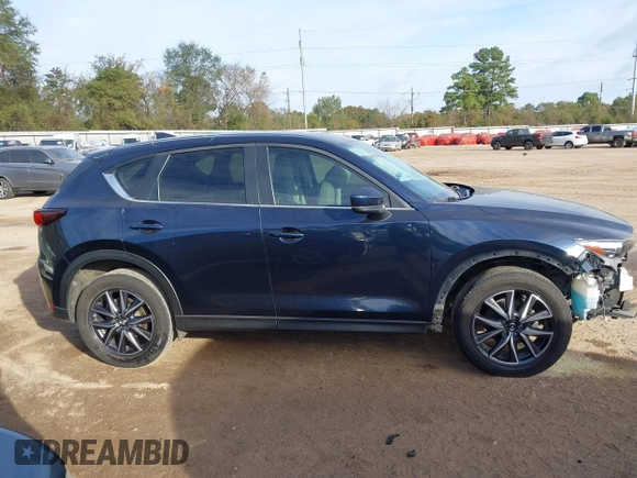 2018 Mazda CX-5 Touring z VIN JM3KFACM0J1389057, wystawiony jako IAAI lot #40922679 z przebiegiem 140 026 mil mil oraz . Historia ofert i sprzedaży dostępna na DreamBid. Obrazek 14.
