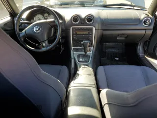 2003 Mazda MX-5 Miata Cloth with VIN JM1NB353430308653, listed as a Copart auction lot 53129865 with 144,549 mi miles and Salvage Title. Bid and sale history available at DreamBid. Image 8.