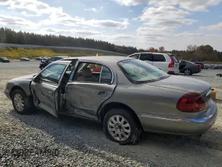 2000 Lincoln Continental with VIN 1LNHM97VXYY878511, listed as a Copart auction lot 78262834 with 143,824 mi miles and Salvage Title. Bid and sale history available at carsss.com. Image 2.
