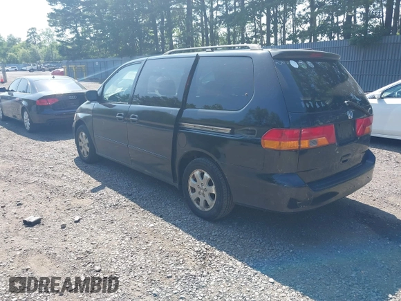 2003 Honda Odyssey EX-L with VIN 5FNRL18003B042487, listed as a IAAI auction lot 42604399 with 188,126 mi miles and . Bid and sale history available at DreamBid. Image 3.
