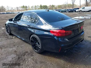 2020 BMW M5 with VIN WBSJF0C05LCE51499, listed as a IAAI auction lot 41982940 with 47,076 mi miles. Bid and sale history available at carsss.com. Image 3.