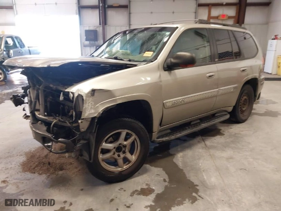 2003 GMC Envoy SLT with VIN 1GKDS13S932299354, listed as a IAAI auction lot 41238557 with 251,535 mi miles. Bid and sale history available at carsss.com. Image 2.