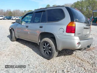 2003 GMC Envoy SLT with VIN 1GKDS13SX32203909, listed as a IAAI auction lot 41457713 with 199,507 mi miles. Bid and sale history available at carsss.com. Image 3.