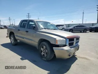 2006 Dodge Dakota SLT z VIN 1D7HW48NX6S709353, wystawiony jako Copart lot #58043225 z przebiegiem 222 008 mil mil oraz Szkoda całkowita • Salvage title. Historia ofert i sprzedaży dostępna na DreamBid. Obrazek 13.