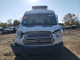 2018 Ford Transit z VIN 1FTYR2CMXJKA73854, wystawiony jako Copart lot #81051414 z przebiegiem Nie podano mil oraz Szkody całkowita. Historia ofert i sprzedaży dostępna na DreamBid. Obrazek 5.