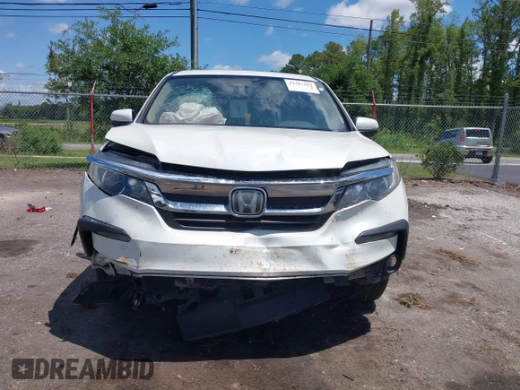 2019 Honda Pilot EX-L with VIN 5FNYF5H42KB026108, listed as a IAAI auction lot 42387593 with 112,556 mi miles and . Bid and sale history available at DreamBid. Image 6.
