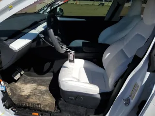 2024 Tesla Model Y Performance with VIN 7SAYGDEF6RA284171, listed as a Copart auction lot 50317205 with 6,870 mi miles and Salvage Title. Bid and sale history available at DreamBid. Image 7.