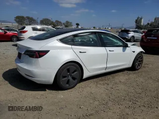2021 Tesla Model 3 Standard Range Plus with VIN 5YJ3E1EA1MF871986, listed as a Copart auction lot 53389475 with Not Provided miles and Salvage Title. Bid and sale history available at DreamBid. Image 3.