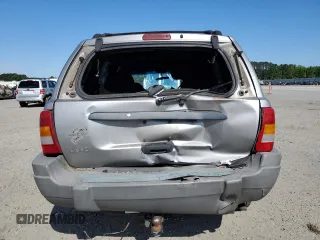 2000 Jeep Grand Cherokee Laredo with VIN 1J4G248S7YC321298, listed as a Copart auction lot 58036255 with 292,779 mi miles and Salvage title. Bid and sale history available at DreamBid. Image 6.