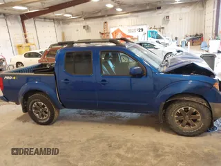 2015 Nissan Frontier SV with VIN 1N6AD0EV4FN709892, listed as a IAAI auction lot 42473594 with 153,103 mi miles and . Bid and sale history available at DreamBid. Image 13.