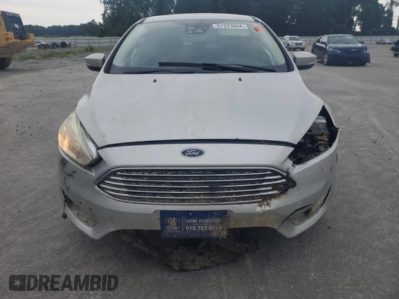 2017 Ford Focus Titanium with VIN 1FADP3N27HL251297, listed as a Copart auction lot 67373094 with 104,733 mi miles and Salvage Title. Bid and sale history available at carsss.com. Image 5.