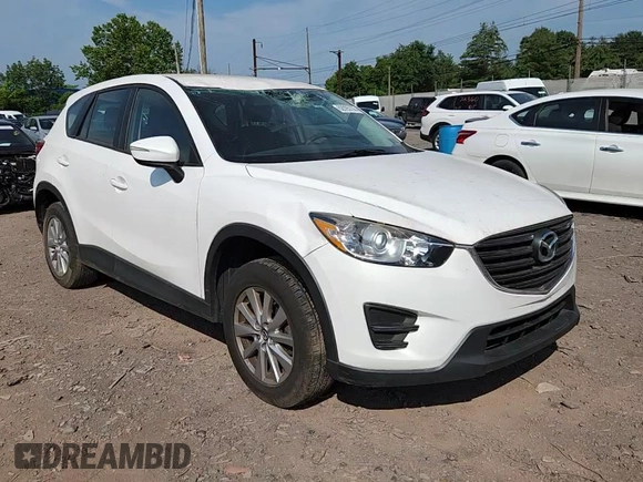 2016 Mazda CX-5 Sport with VIN JM3KE4BYXG0704194, listed as a Copart auction lot 62095735 with 93,970 mi miles and Salvage title. Bid and sale history available at DreamBid. Image 14.