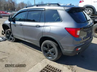 2021 Honda Passport Elite with VIN 5FNYF8H07MB018359, listed as a IAAI auction lot 41834413 with 28,278 mi miles and . Bid and sale history available at DreamBid. Image 3.