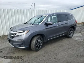 2020 Honda Pilot Touring 7-Passenger z VIN 5FNYF6H60LB039609, wystawiony jako Copart lot #51753425 z przebiegiem 57 512 mil mil oraz Szkoda całkowita • Salvage title. Historia ofert i sprzedaży dostępna na DreamBid. Obrazek 1.